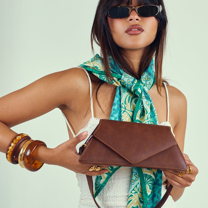 Brown envelope bag with a silk scarf