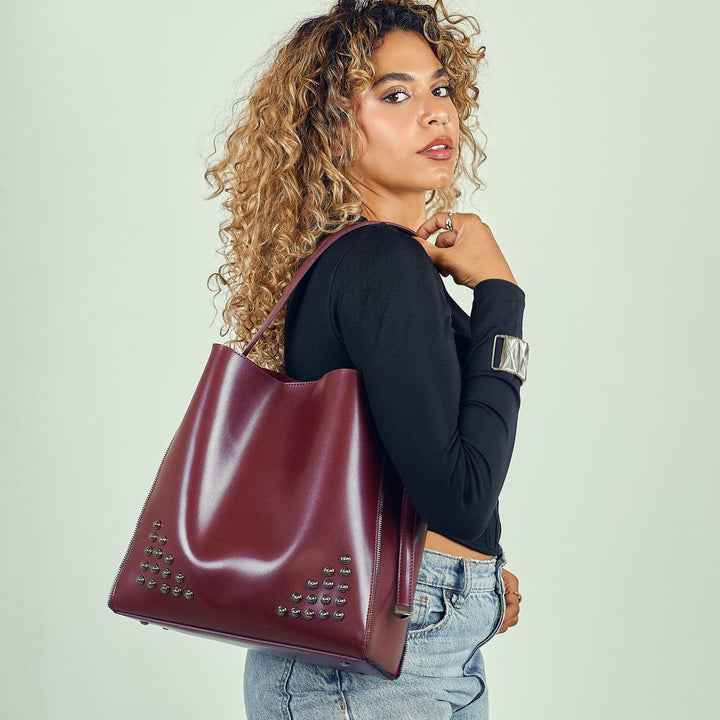 Burgundy studded bag over the shoulder